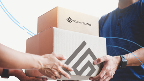 Two shipping boxes being handed off, displaying the brand name Square Signs.