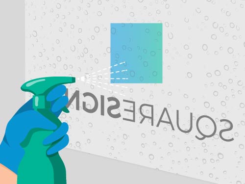 Installation step 5 - Spraying the soap water on the adhesive backing of window decal