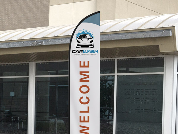 A custom feather flag used at a car wash to welcome customers.