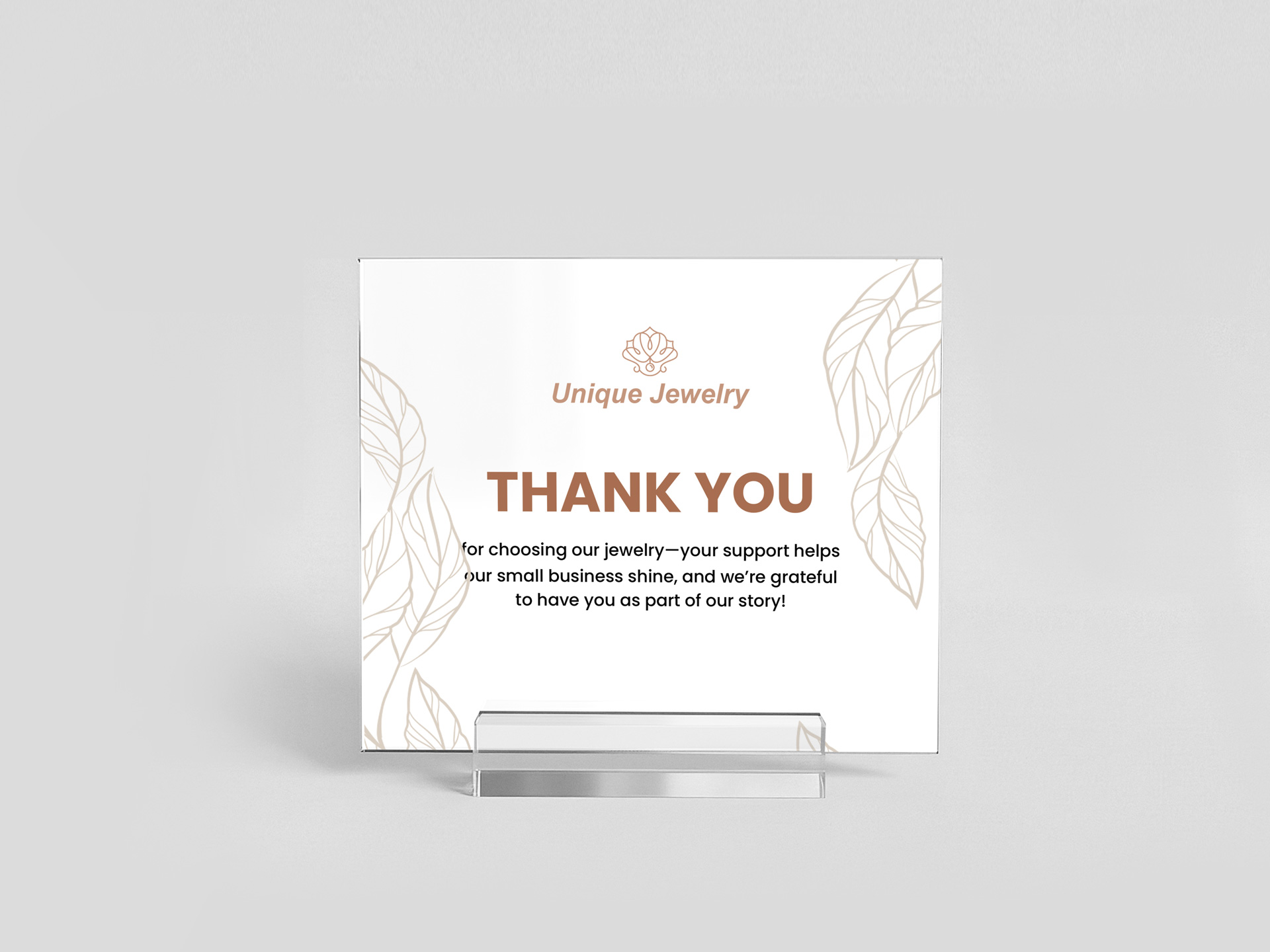 White acrylic tabletop sign for a jewelry store expressing gratitude to their customers.