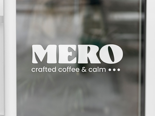 White vinyl lettering reading Mero with the brand's motto.