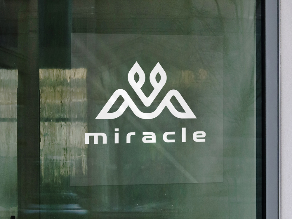 Clear static display applied on a window featuring a brand's name and logo in white