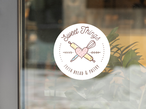 Bakery window decal with a clear finish displaying the brand's name and logo