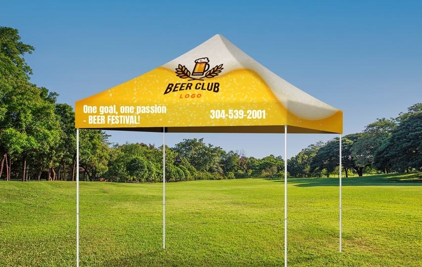 Yellow Beer Club custom event tent set up on grass with festival slogan and contact number printed.