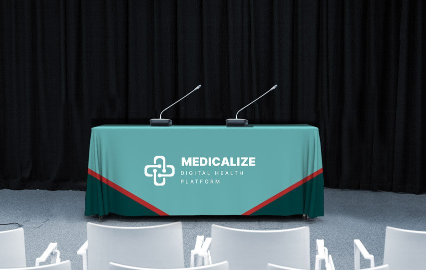 Custom logo table cover reading Medicalize with the corresponding brand logo.