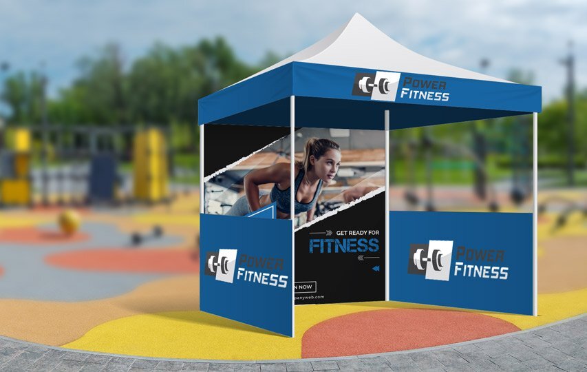 Blue Power Fitness canopy tent with custom graphics and a photo of a woman working out inside.